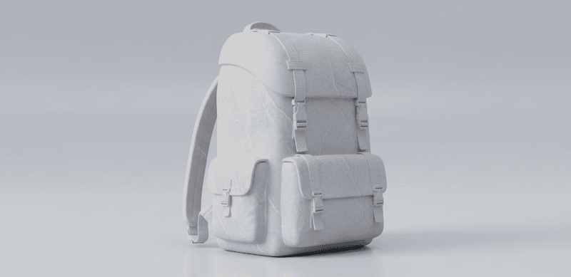 Ein schwerer Rucksack aus Stein liegt auf dem Boden und symbolisiert das Ablegen von Konsumschulden und finanzieller Last.